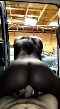 Ebony Girl Having Fun in Automobile Garage